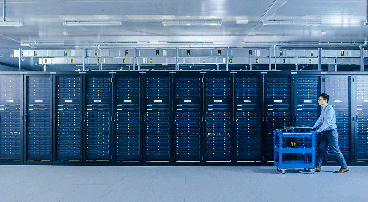 IT Technician Working with Server Racks