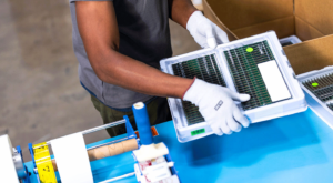 man holds full tray of RAM