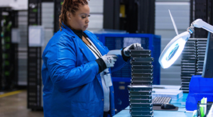 female employee scanning hard drives